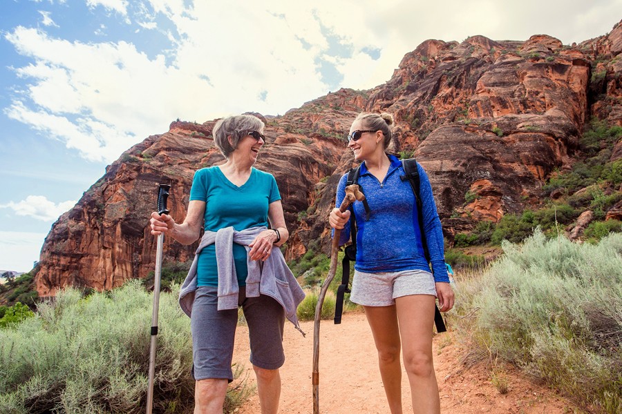 Two women hiking in the desert
