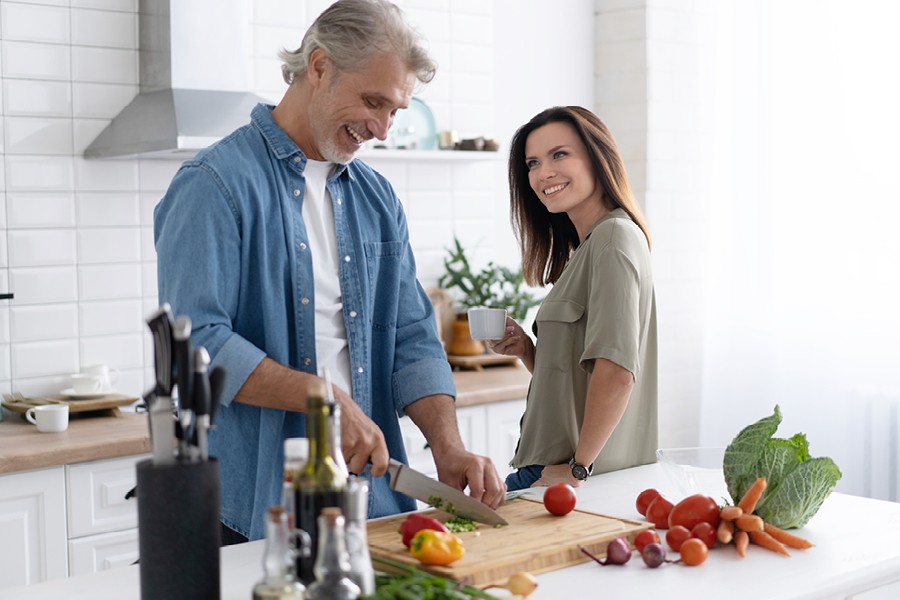 Man and woman cooking in a kitchen